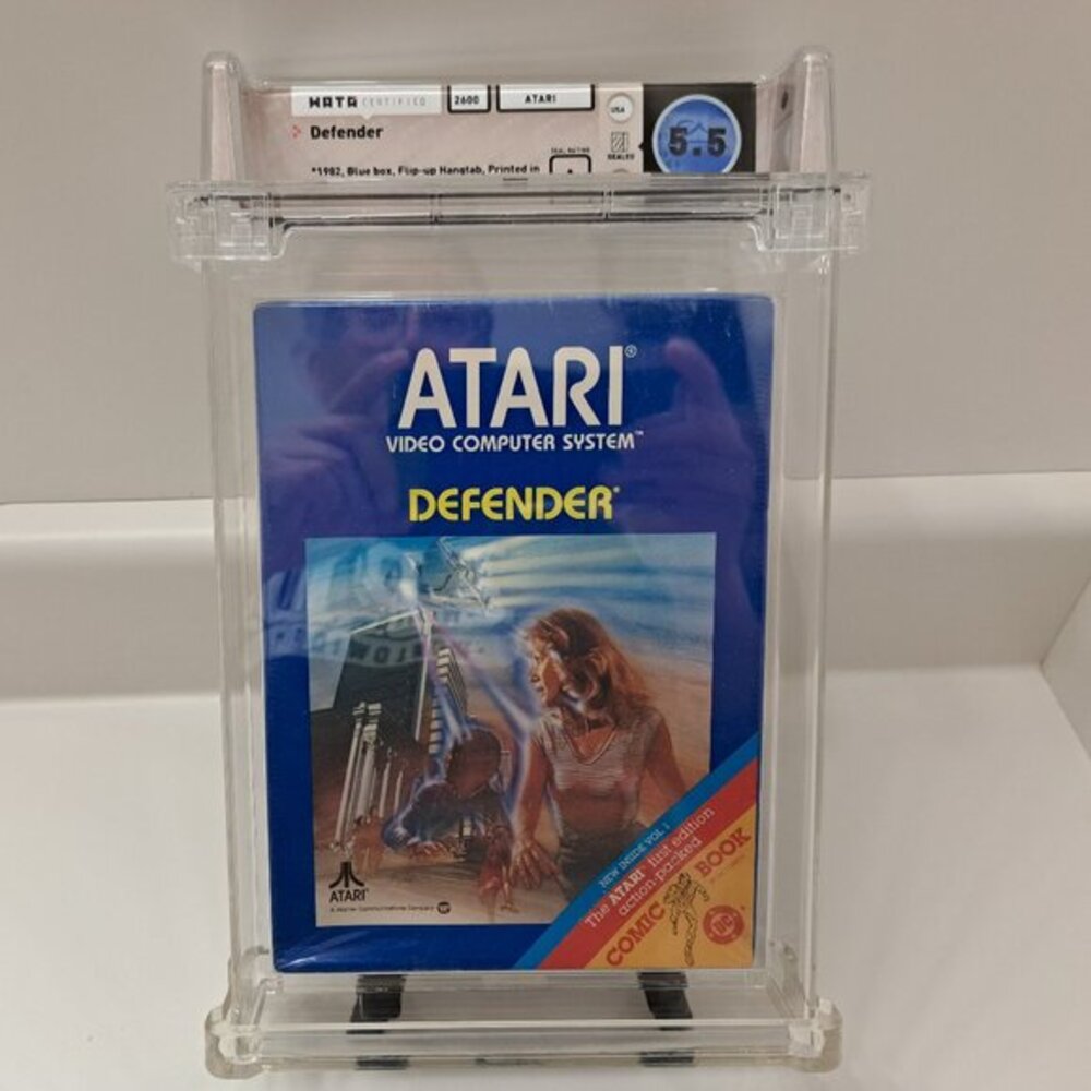 Atari 2600 DEFENDER - EARLY HANGTAB BLUE BOX! WATA GRADED 5.5! NEW & UNOPENED!